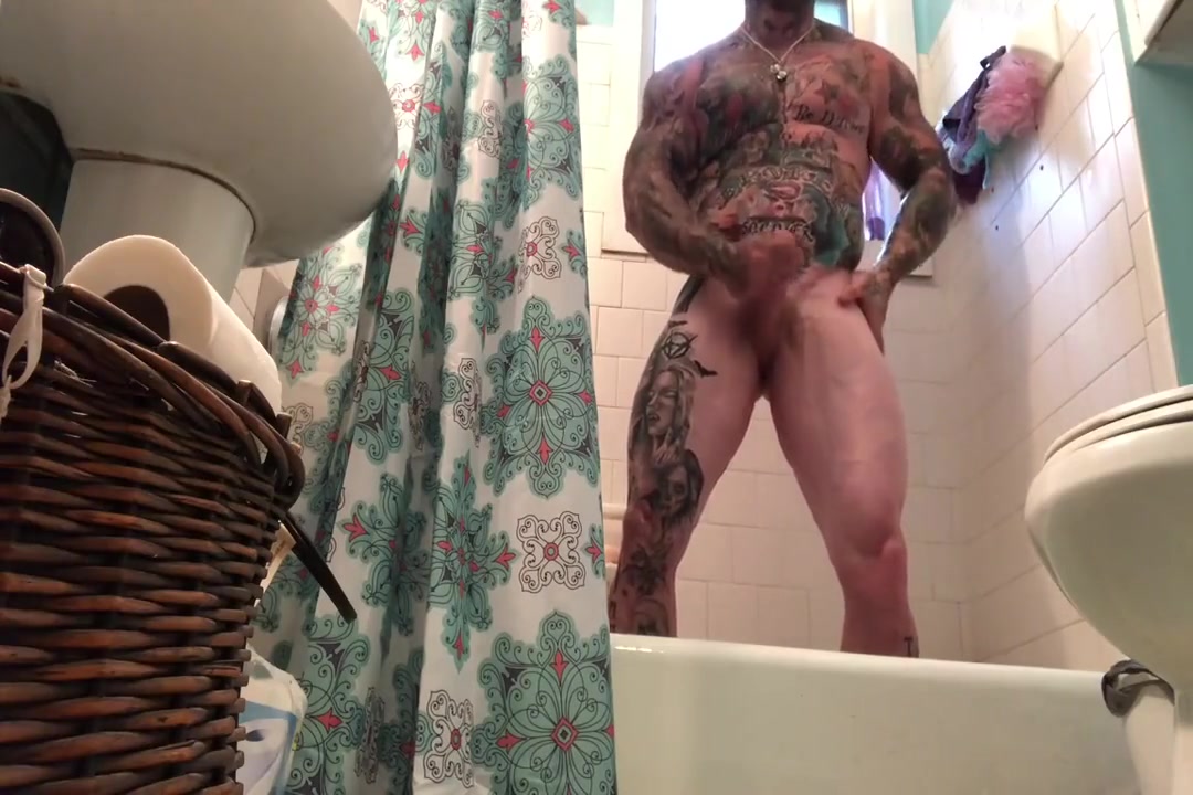 tattooed muscle stud takes a shower