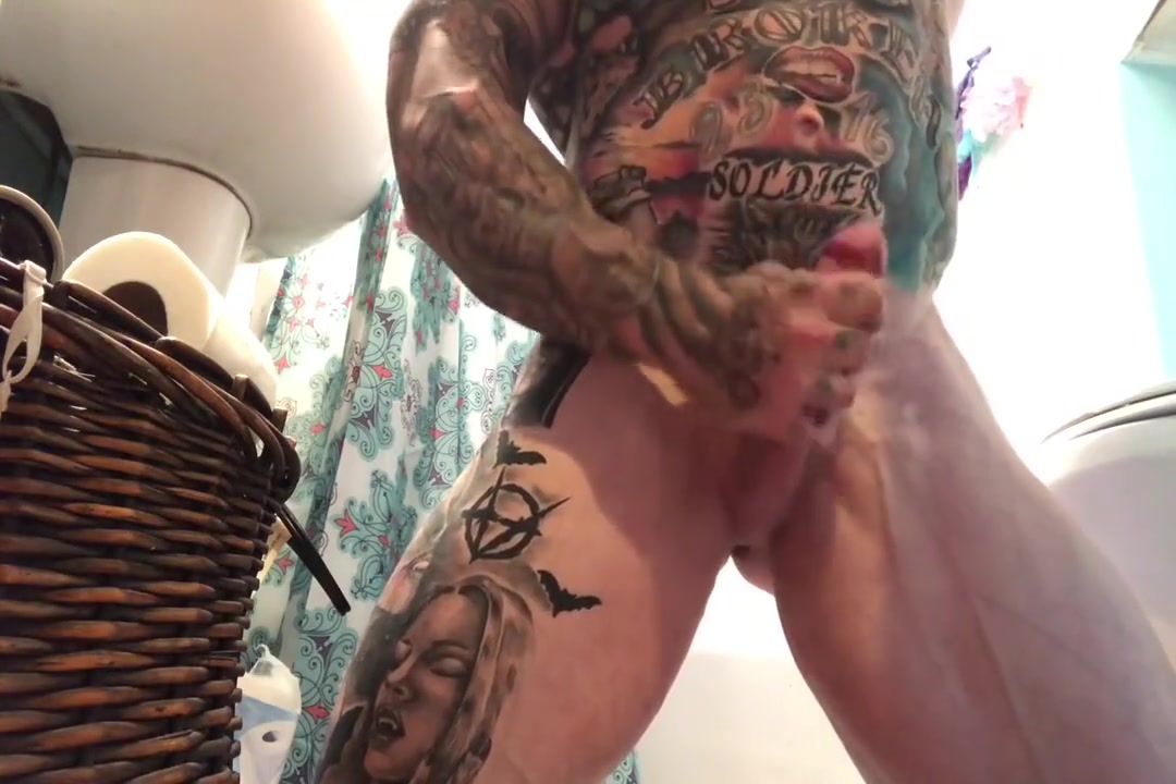 tattooed muscle stud takes a shower