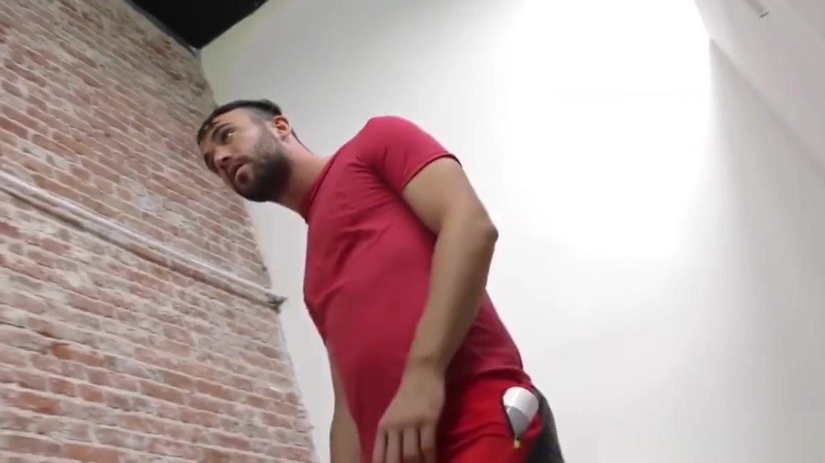 Bearded guy sucking off a black cock at a gloryhole