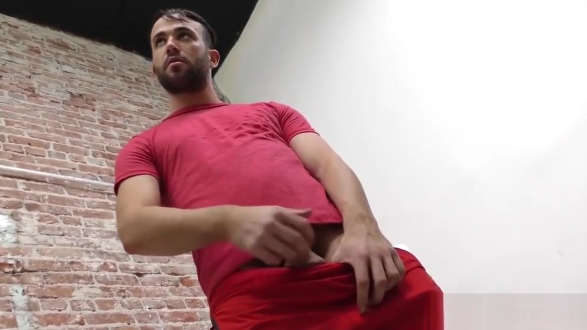 Bearded guy sucking off a black cock at a gloryhole