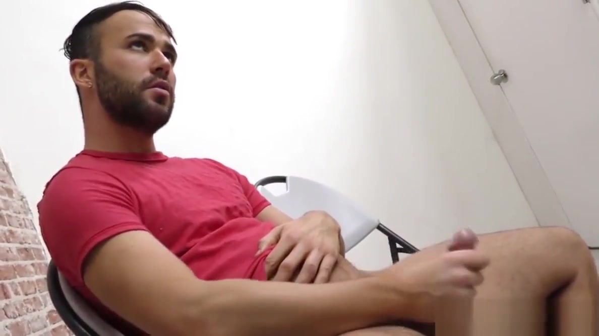 Bearded guy sucking off a black cock at a gloryhole