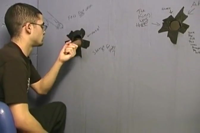 Thin gay white guy sucking off black cocks at a gloryhole