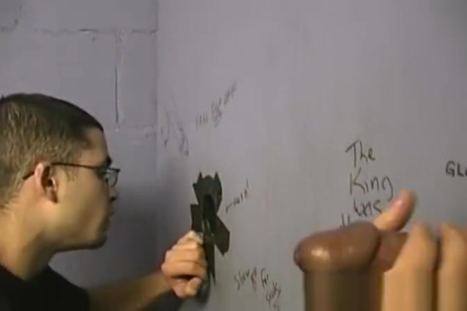 Thin gay white guy sucking off black cocks at a gloryhole