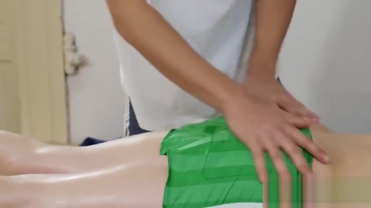 Will has Andrew on the massage table rubbing down his back