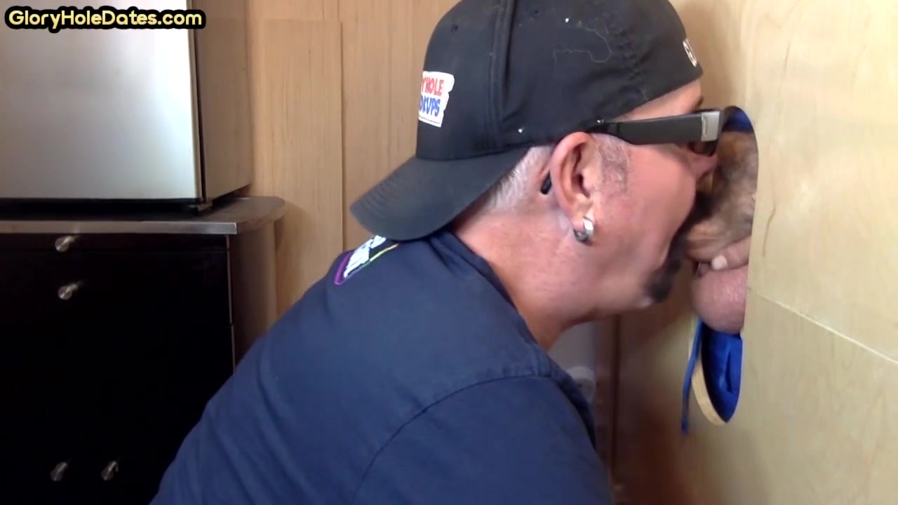 Mature DILF deepthroats and slurps on gloryhole dong