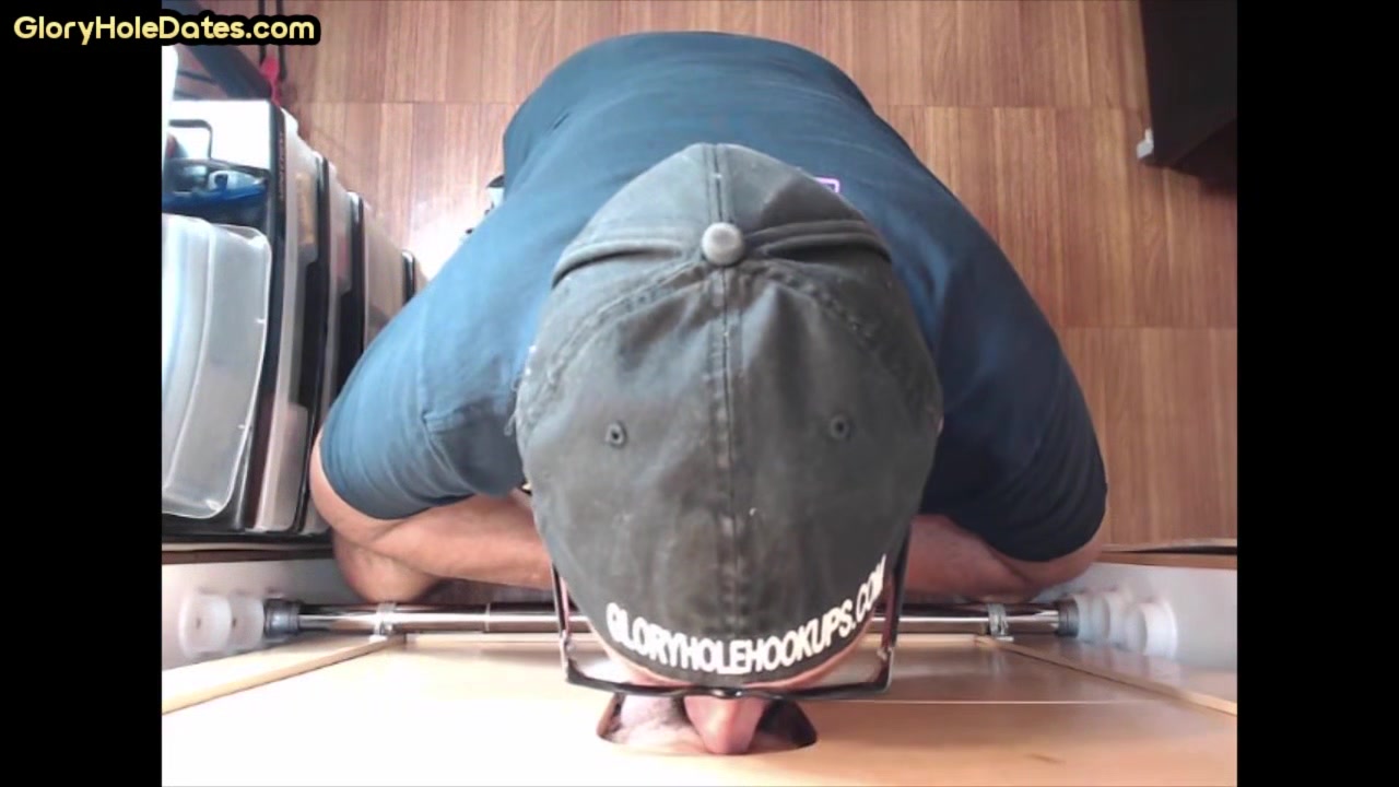 Mature DILF deepthroats and slurps on gloryhole dong
