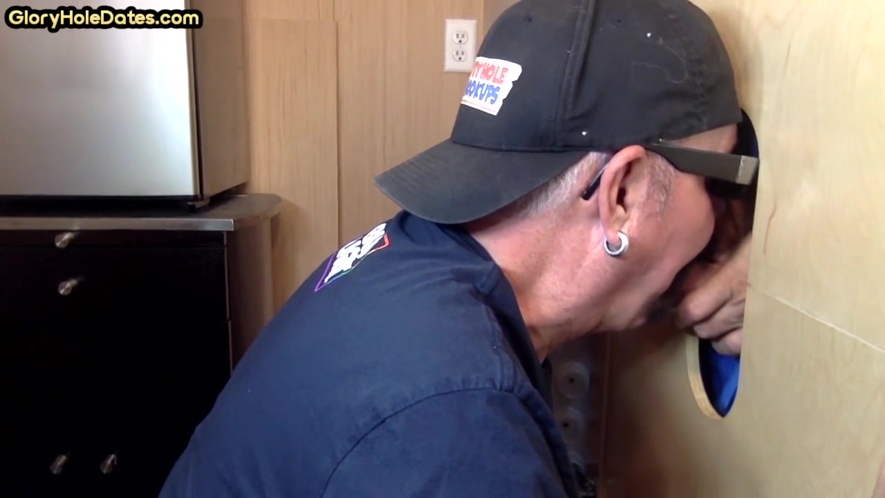 Mature DILF deepthroats and slurps on gloryhole dong