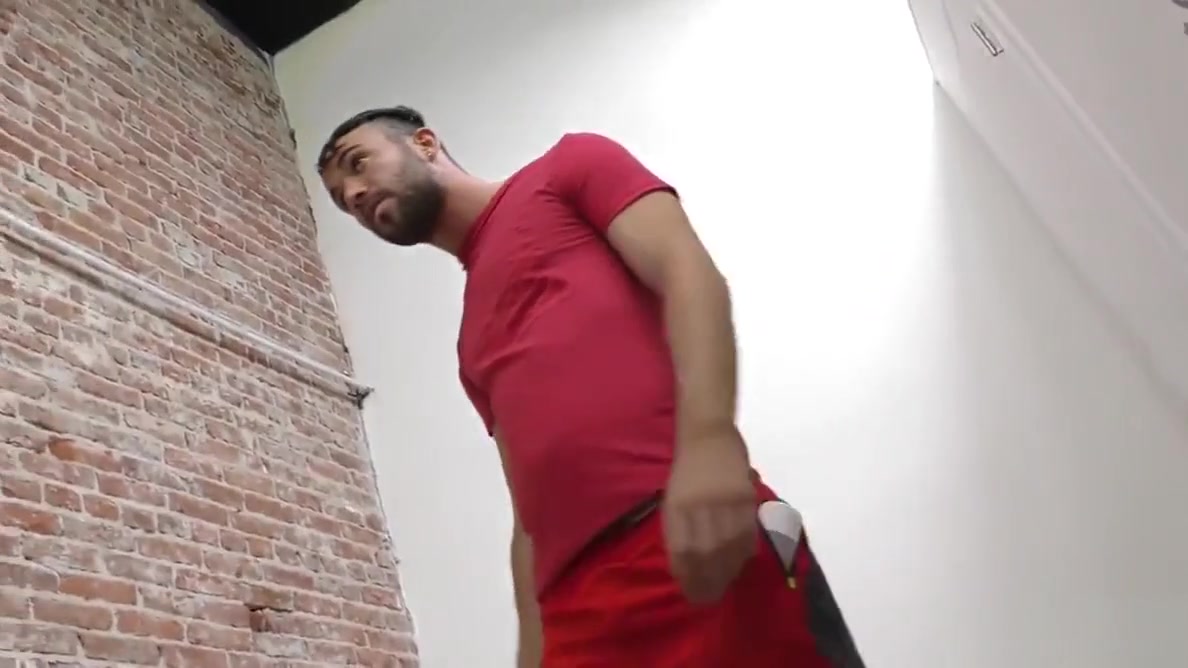 Bearded guy sucking off a black cock at a gloryhole