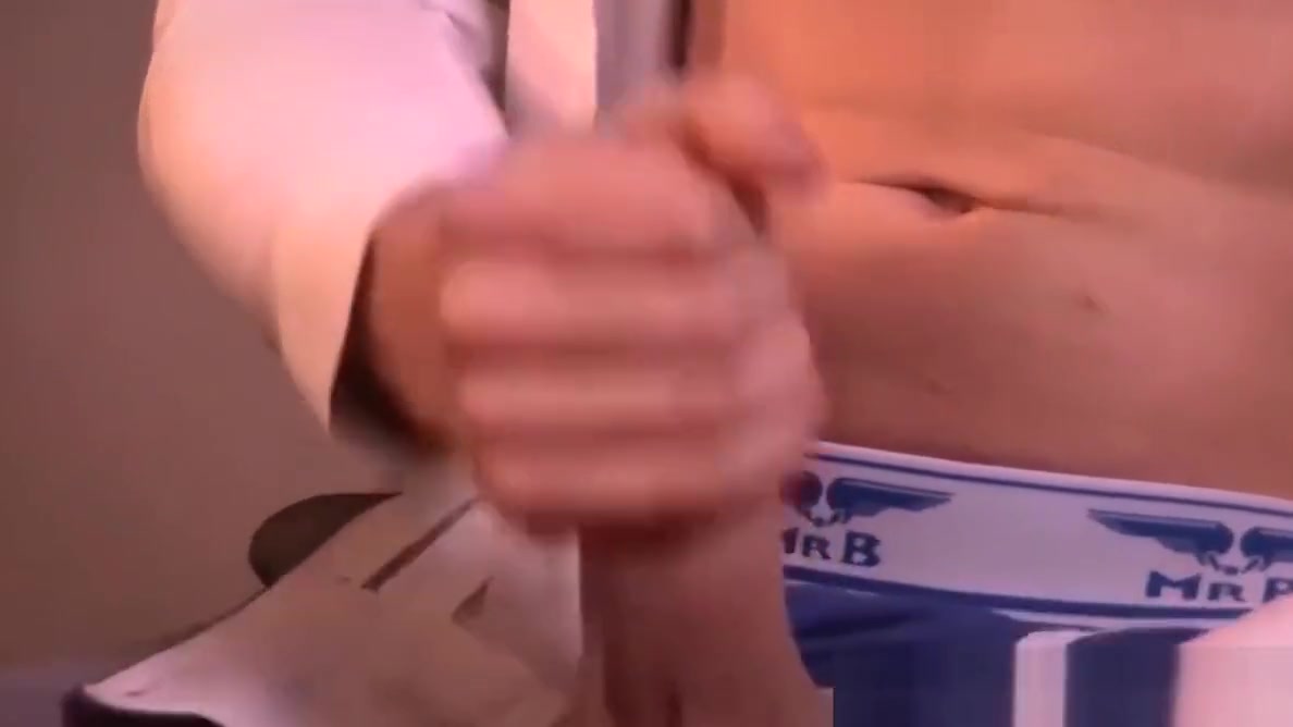 Horny gay dude wanks his nice big dick at the office