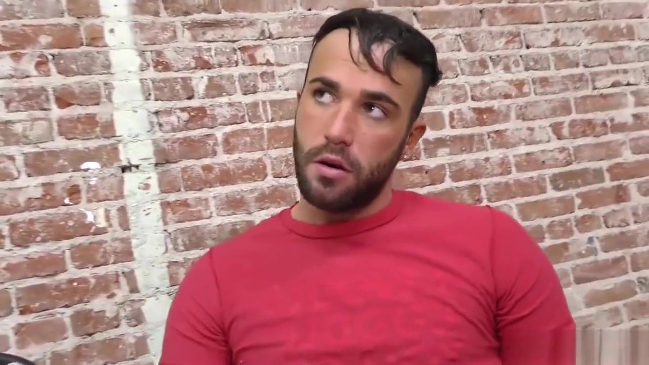 Bearded guy sucking off a black cock at a gloryhole