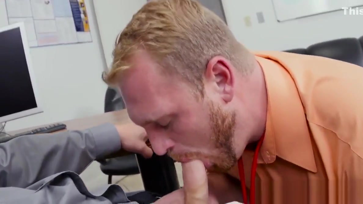 Muscular stud pounds bloke on office desk