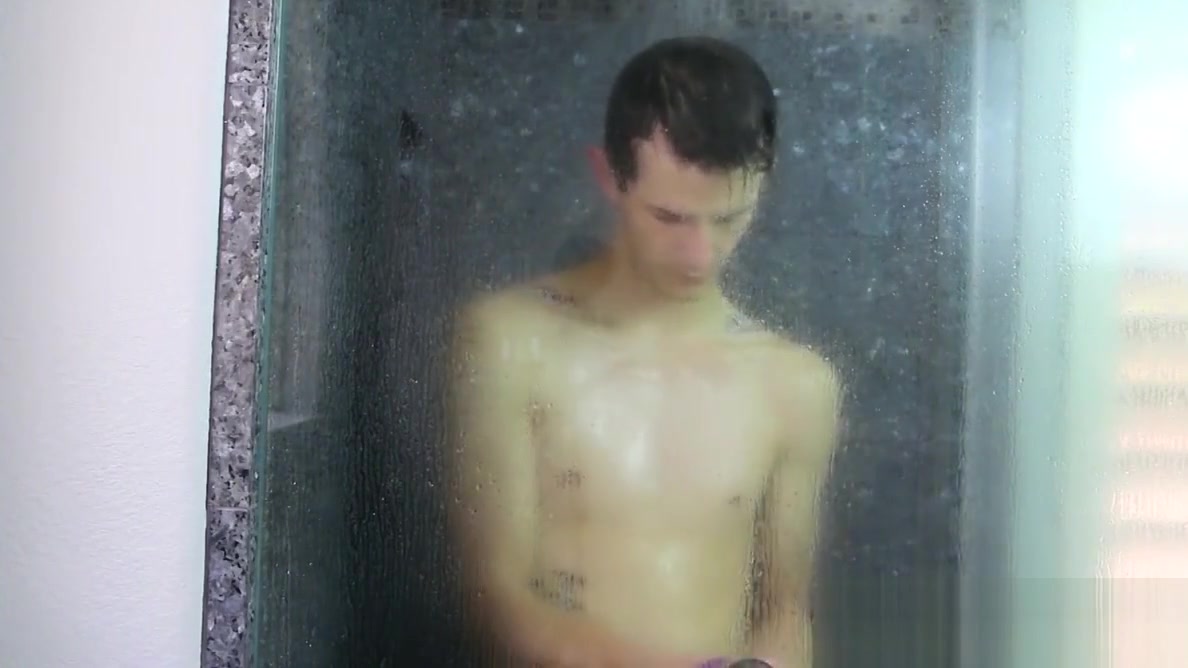 Nasty cock sucker Jasper Robinson wanks in the shower solo