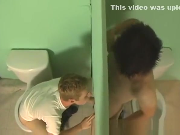 Twink blowing two cocks at the gloryhole for that jizz