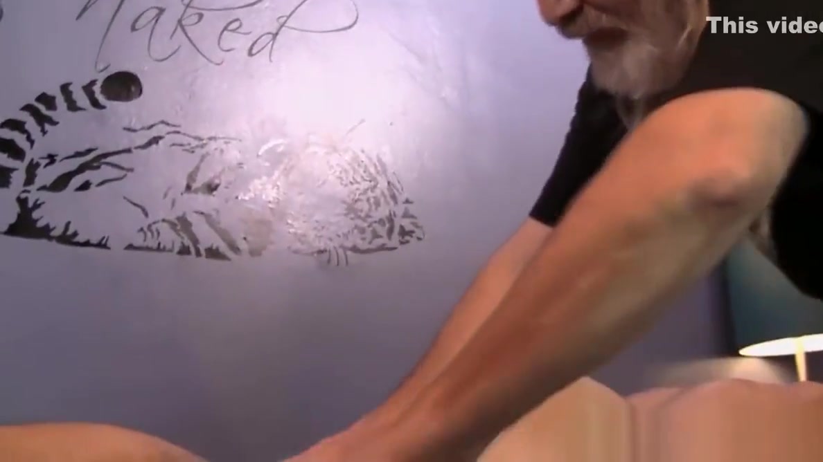 Dildo fucked jock gets a slow massage from bearded older guy
