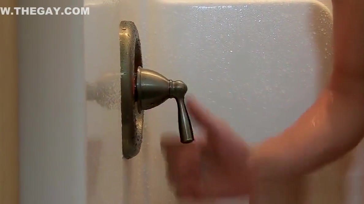 Cute twink gets his share of fat cock under a hot shower