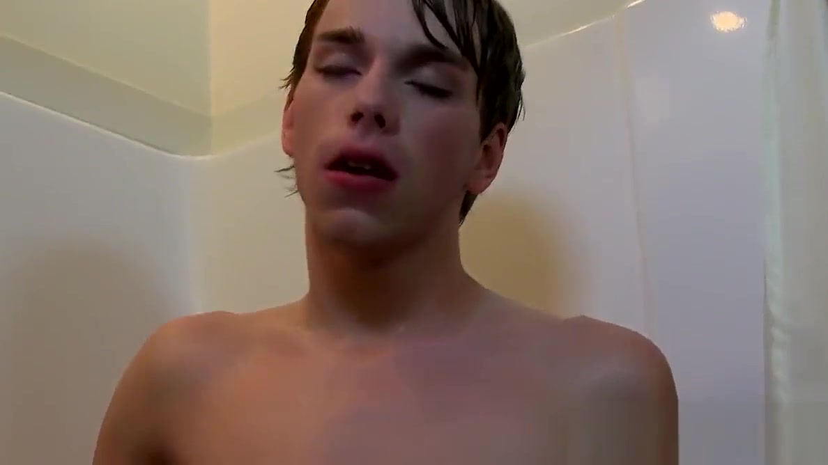 Cute twink gets his share of fat cock under a hot shower