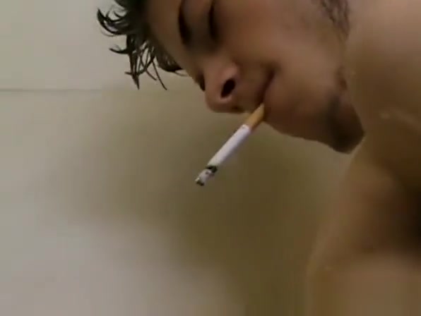 Skinny gay Bleu jerking off while smoking in the shower