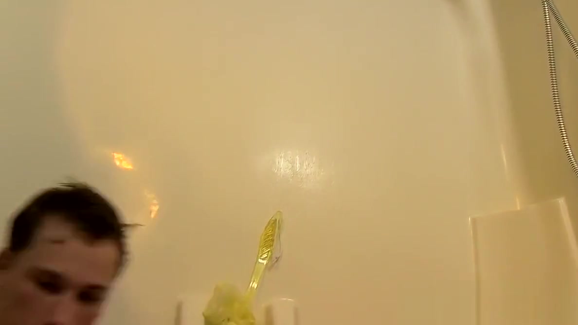 Good looking twink plays with his dick in the shower solo
