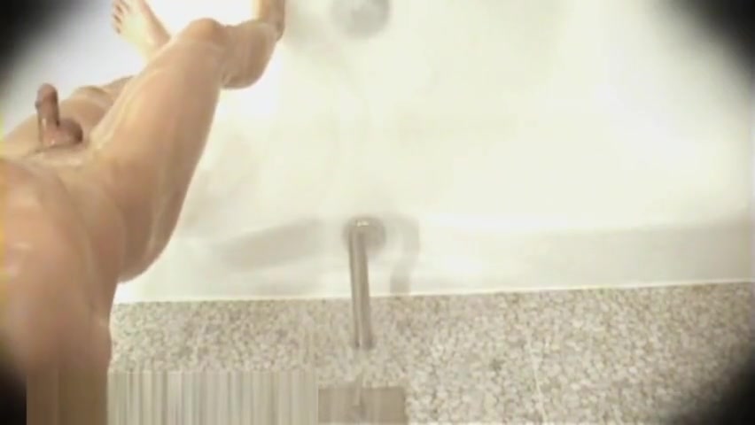 Brunette boy showering
