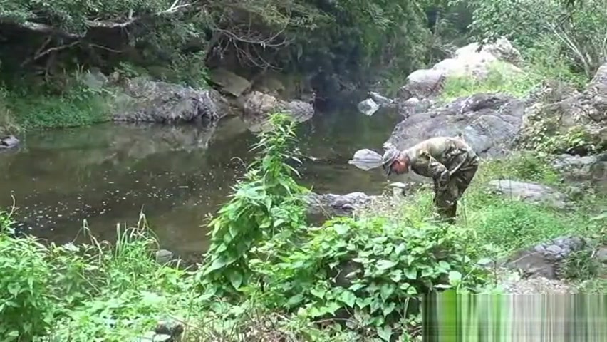 Two military lads resting by the river