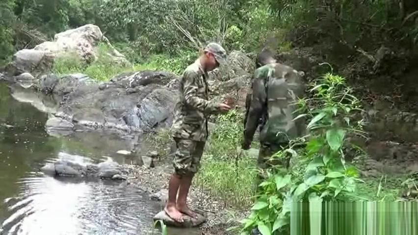 Two military lads resting by the river