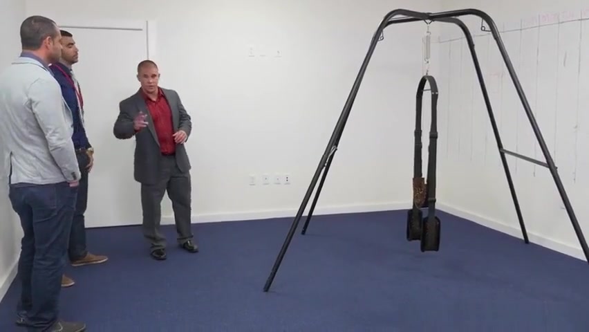 Suited studs assfuck on swing in office