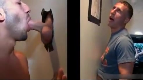 Sexy stud gets his massive white penis sucked through gloryhole