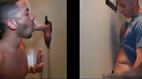 Sexy stud gets his massive white penis sucked through gloryhole