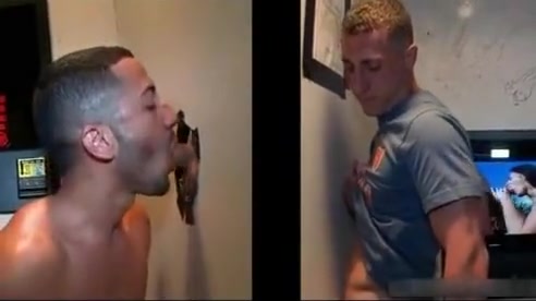 Sexy stud gets his massive white penis sucked through gloryhole