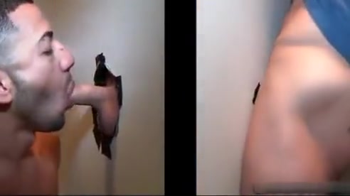 Sexy stud gets his massive white penis sucked through gloryhole