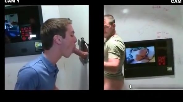 Muscled dude gets fellatio by kinky gay dude through gloryhole