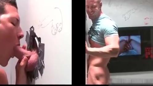 Muscled bald dude gets hot fellatio through gloryhole