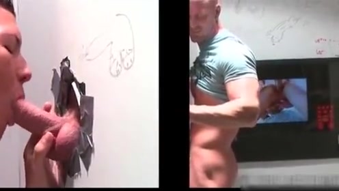 Muscled bald dude gets hot fellatio through gloryhole