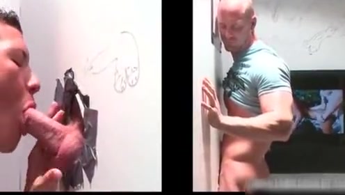 Muscled bald dude gets hot fellatio through gloryhole