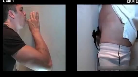 Dude gets blowjob through gloryhole by kinky gay dude