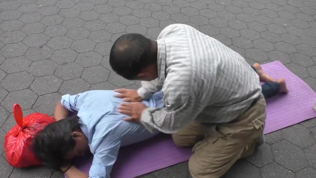 Topless man with his belly button and nipples pierced massaged