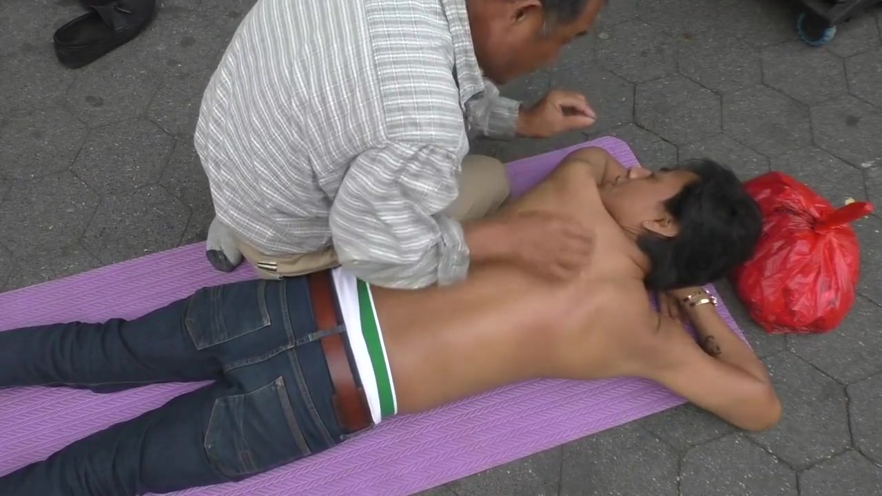 Topless man with his belly button and nipples pierced massaged
