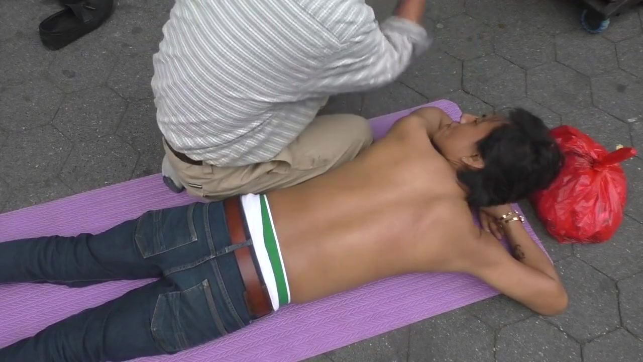 Topless man with his belly button and nipples pierced massaged