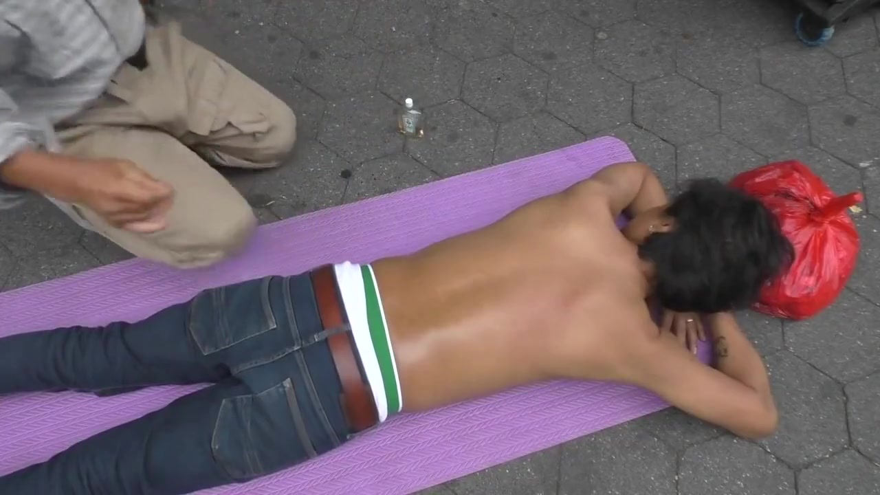 Topless man with his belly button and nipples pierced massaged