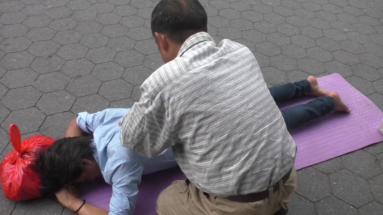 Topless man with his belly button and nipples pierced massaged