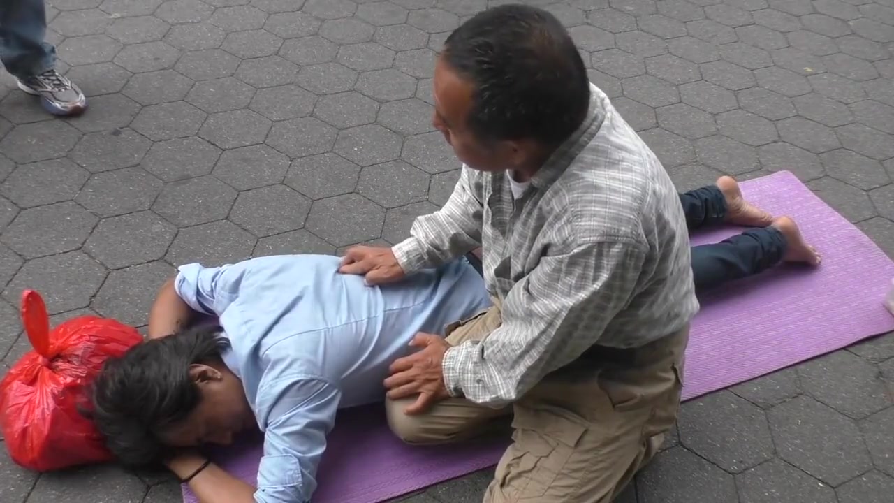 Topless man with his belly button and nipples pierced massaged