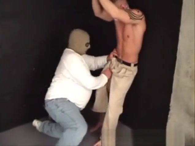 Handsome ex-military strung up by his wrists gagged stripped and