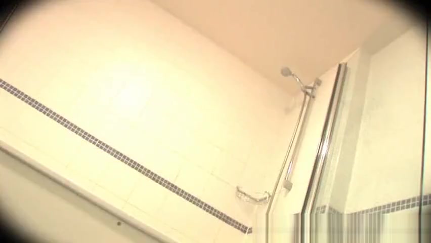 Muscled dude showering alone
