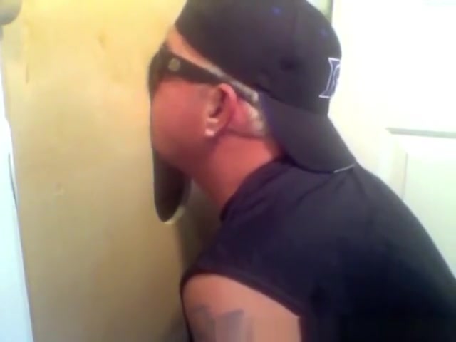 Two hot visitors take turns for a hot glory hole blowjob