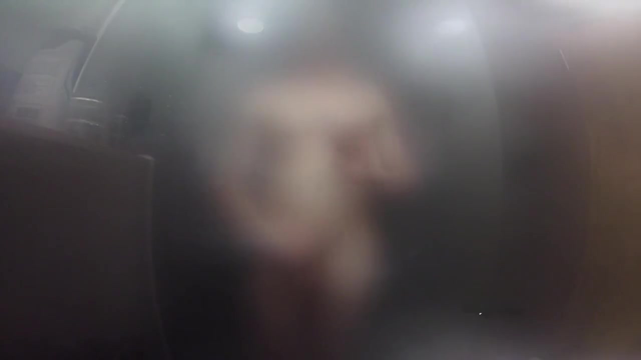 Twink jerks off and presses cock against glass in steamy shower session