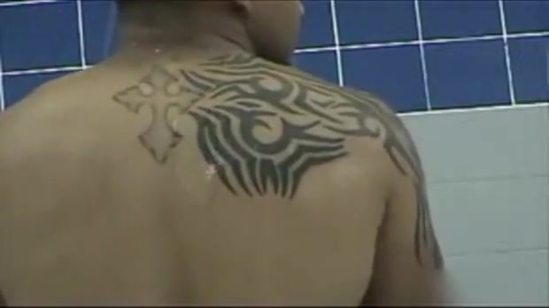 Two muscular marines take a long shower.