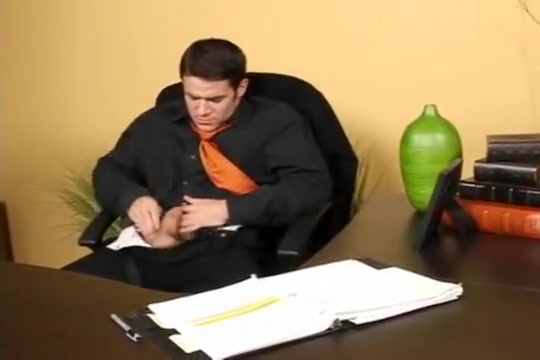 Chris fucks himself with a dildo in the office