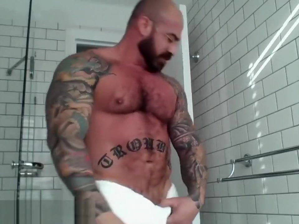 Tattooed muscle stud showers
