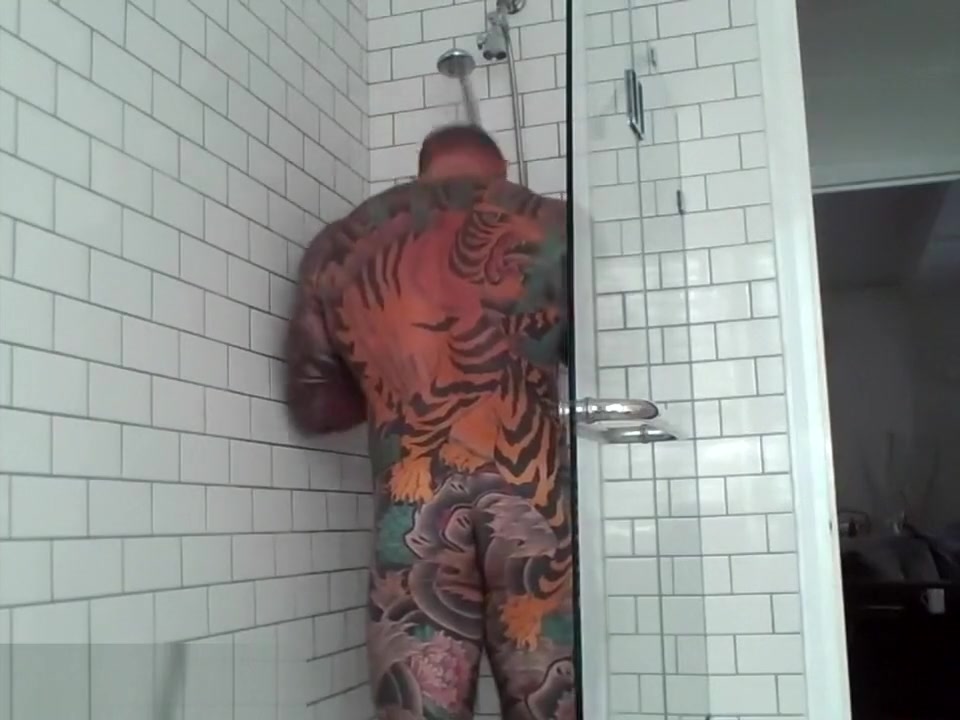 Tattooed muscle stud showers