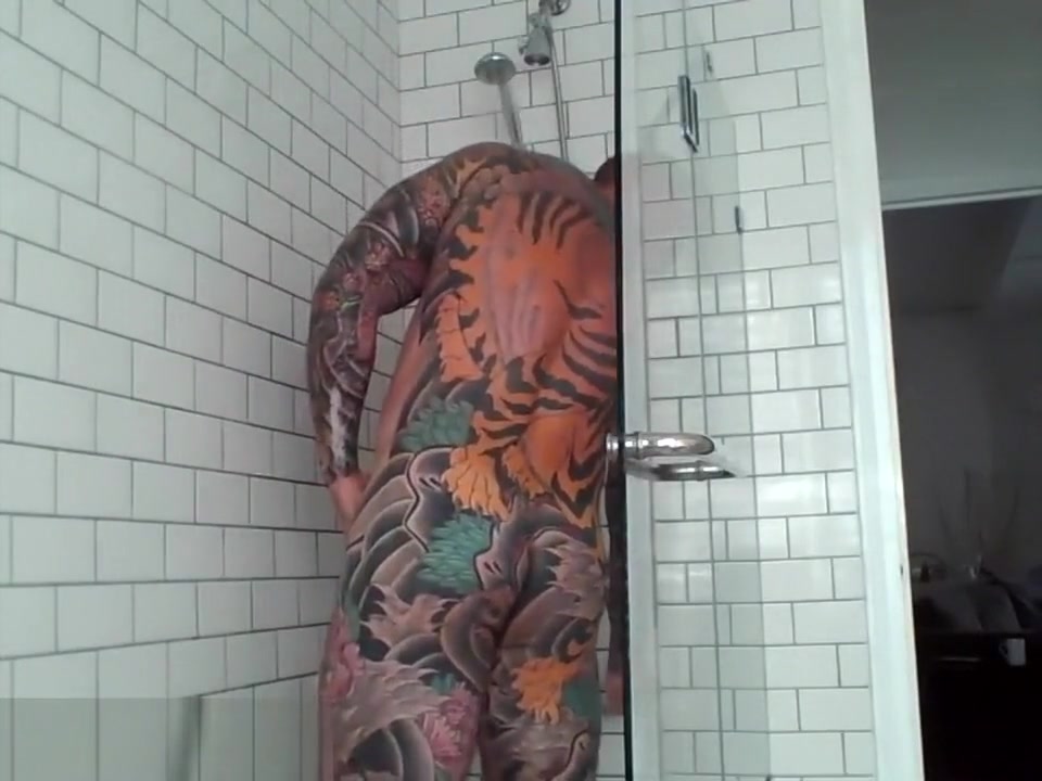 Tattooed muscle stud showers